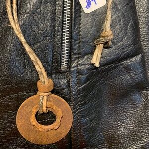 Post apocalyptic style industrial hardware necklace on a hemp cord